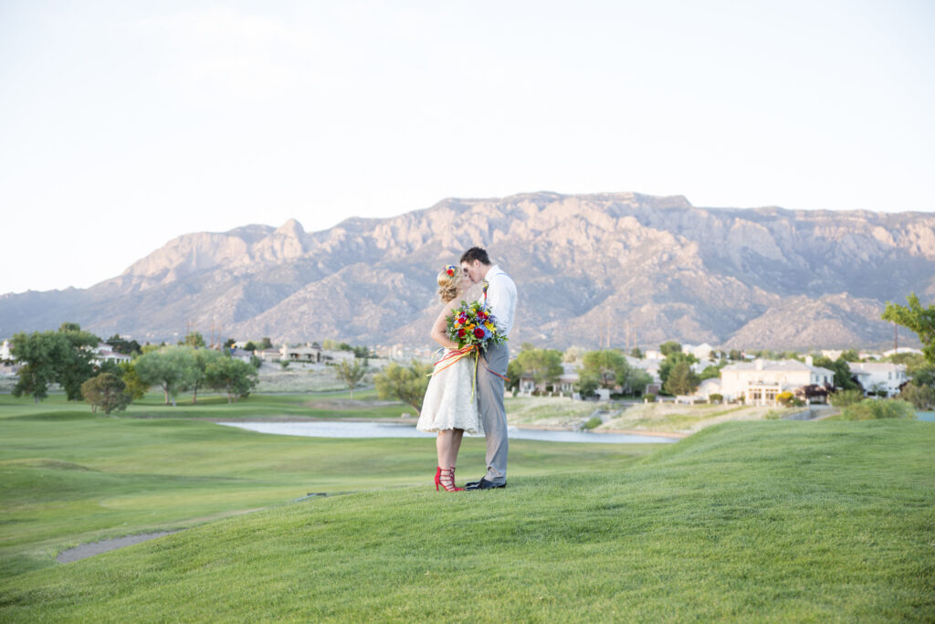 Image of bride and groom with mountain view at Tanoan Country Club
