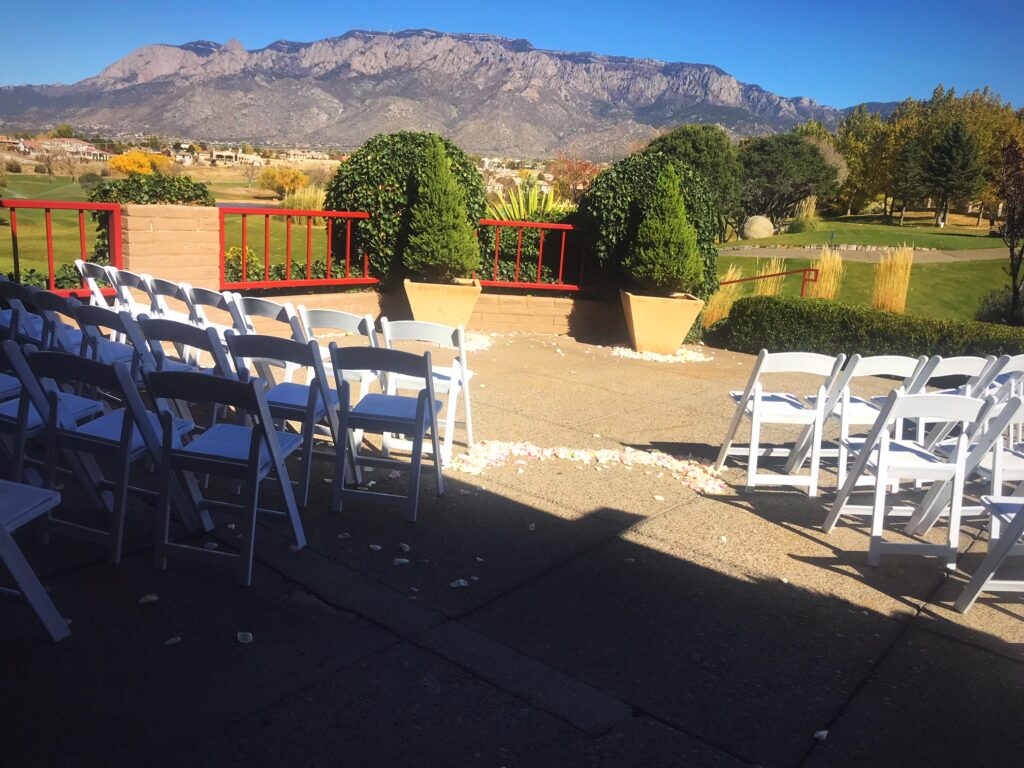 Image of outdoor ceremony with mountain view at Tanoan Country Club